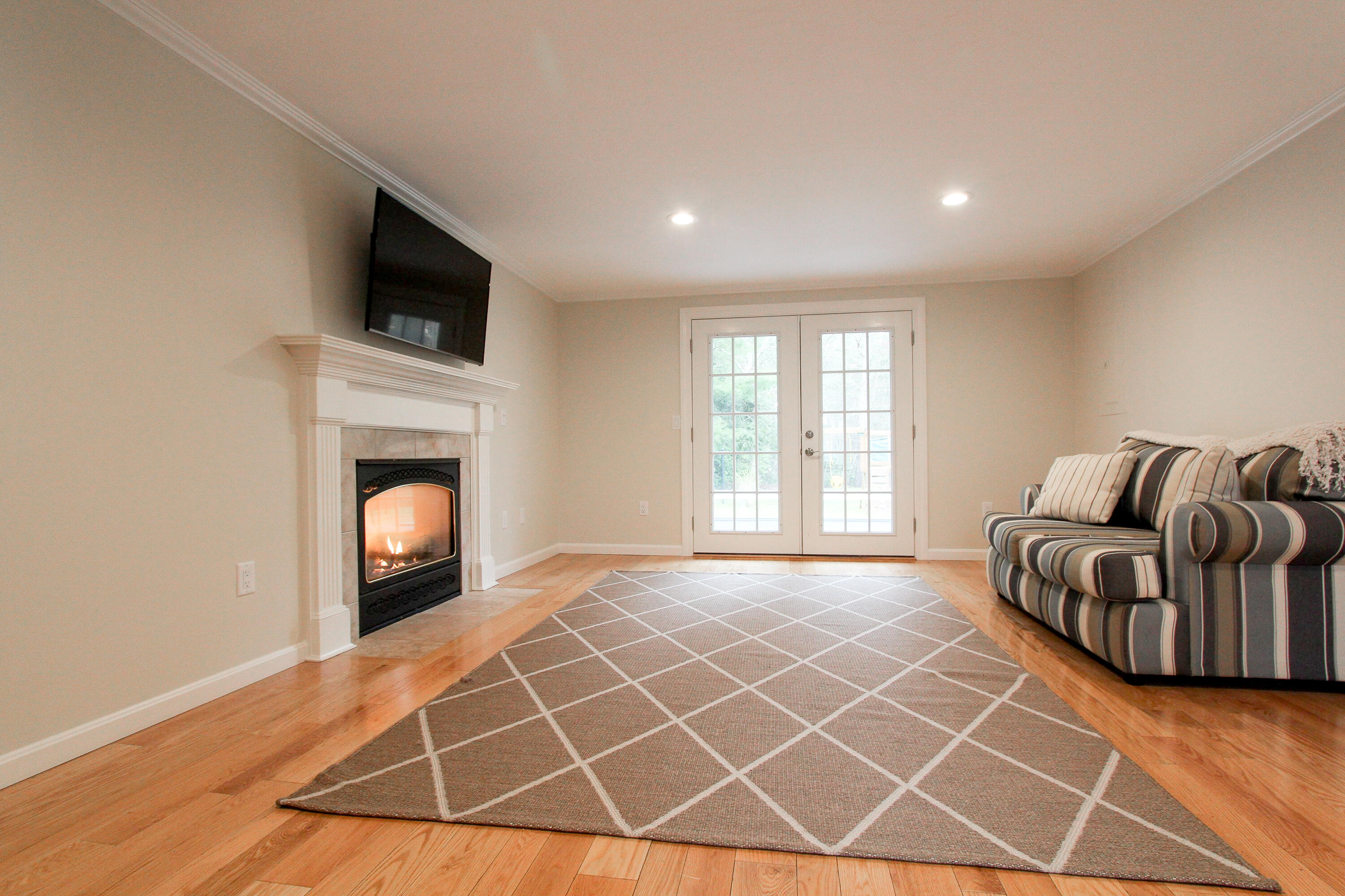 199 Skunknet Road Centerville, MA 02632 - Photo 4 of 37 a view of livingroom with furniture and fireplace