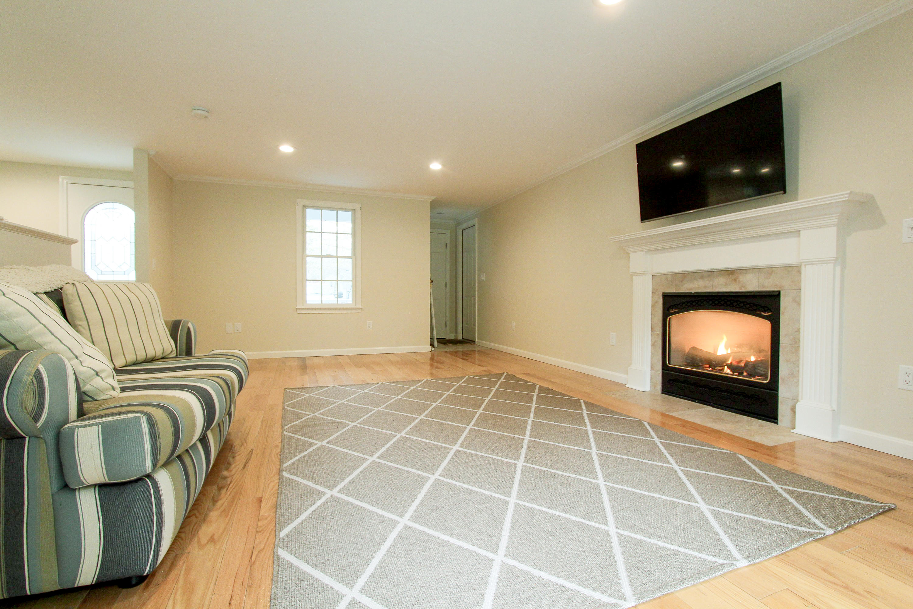 199 Skunknet Road Centerville, MA 02632 - Photo 9 of 37 a living room with furniture and a flat screen tv