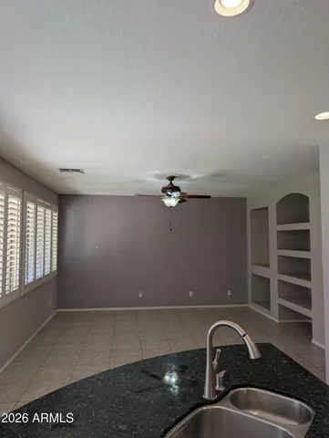 wooden floor in a hall with a window