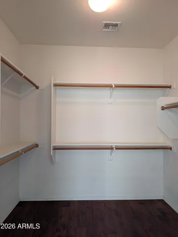 a view of an empty walk in closet