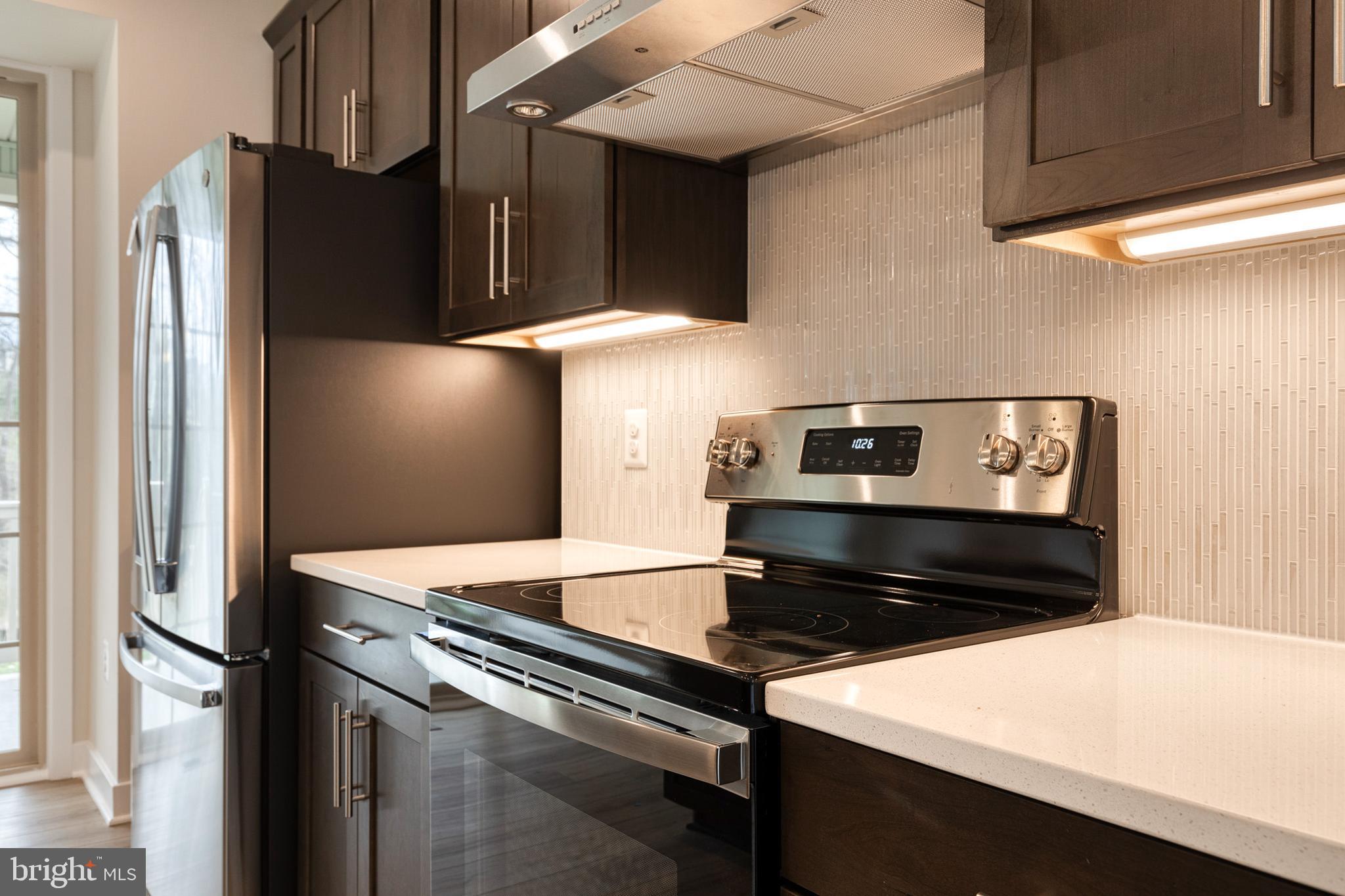 3433 Jacobs Ford Way Hanover, MD 21076 - Photo 12 of 37 a kitchen with a refrigerator stove and microwave