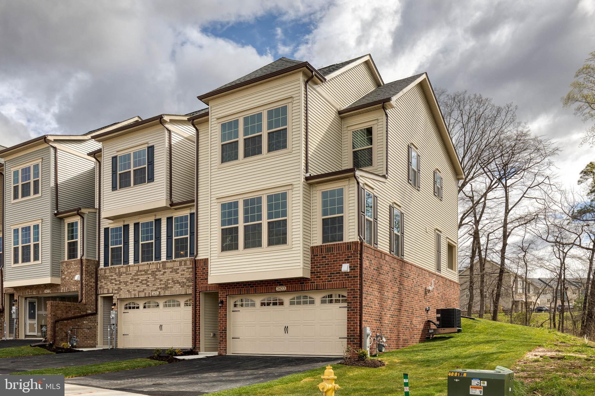 3433 Jacobs Ford Way Hanover, MD 21076 - Photo 2 of 37 a view of a white building among the yard