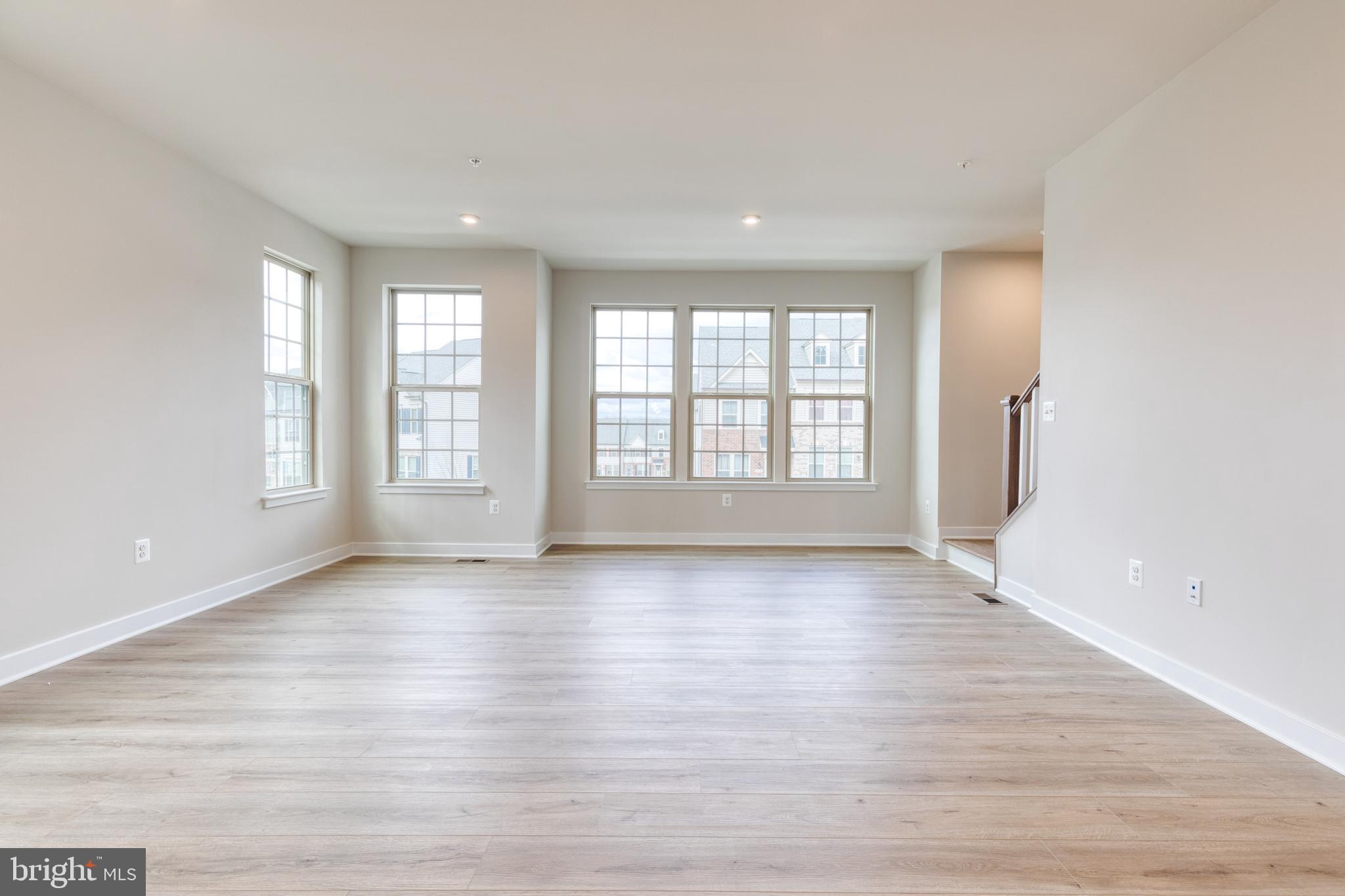 3433 Jacobs Ford Way Hanover, MD 21076 - Photo 24 of 37 an empty room with wooden floor and windows