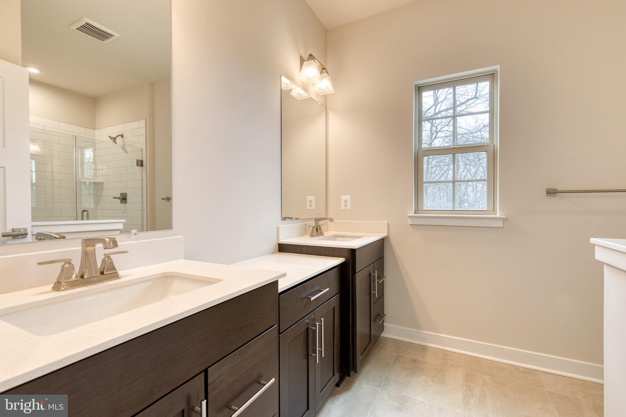 3433 Jacobs Ford Way Hanover, MD 21076 - Photo 26 of 37 a bathroom with a sink double vanity and a mirror