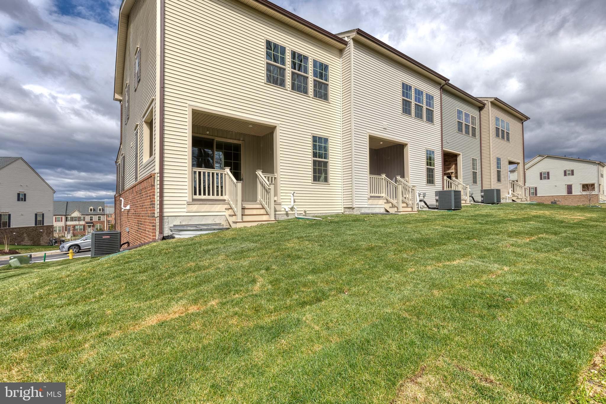 3433 Jacobs Ford Way Hanover, MD 21076 - Photo 3 of 37 a front view of a house with a yard