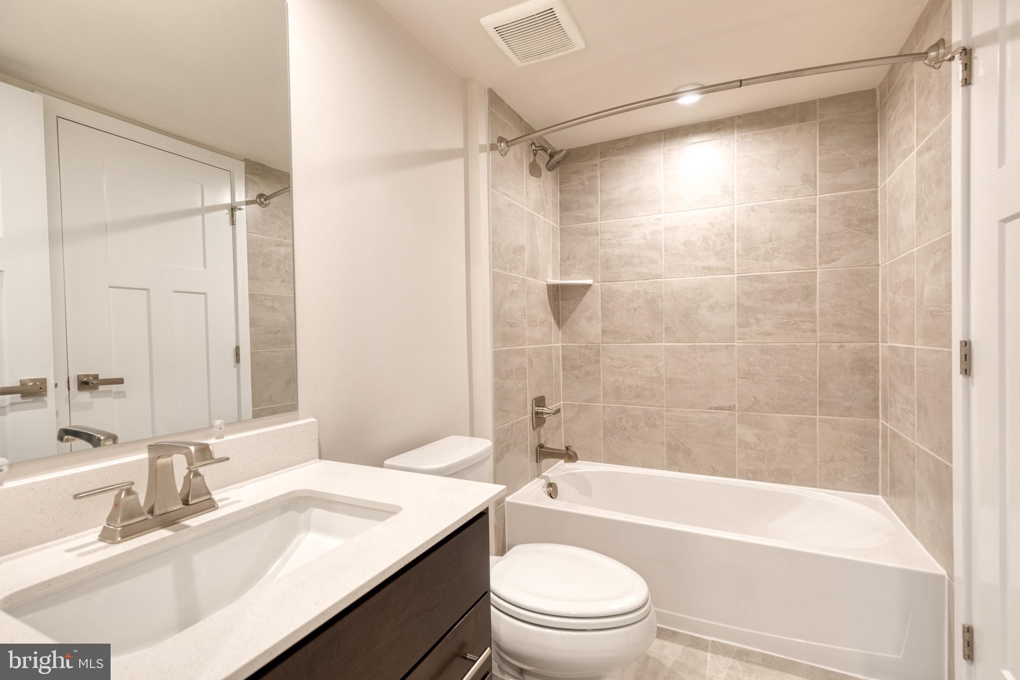 3433 Jacobs Ford Way Hanover, MD 21076 - Photo 8 of 37 a bathroom with a sink a toilet and a bathtub