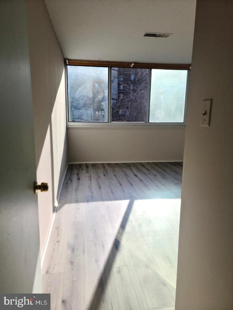1830 Metzerott Road, Unit 207 Adelphi, MD 20783 - Photo 8 of 11 a view of an empty room and window