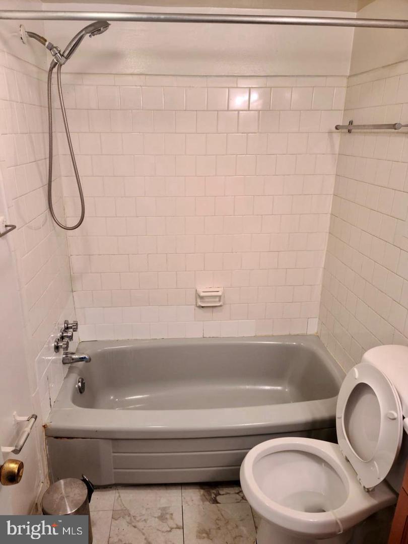 1830 Metzerott Road, Unit 207 Adelphi, MD 20783 - Photo 9 of 11 a bathroom with a sink and a toilet