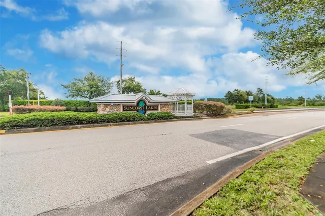 a front view of a house with a garden and pathway