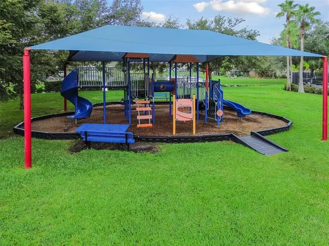 a view of a chair and table under an umbrella