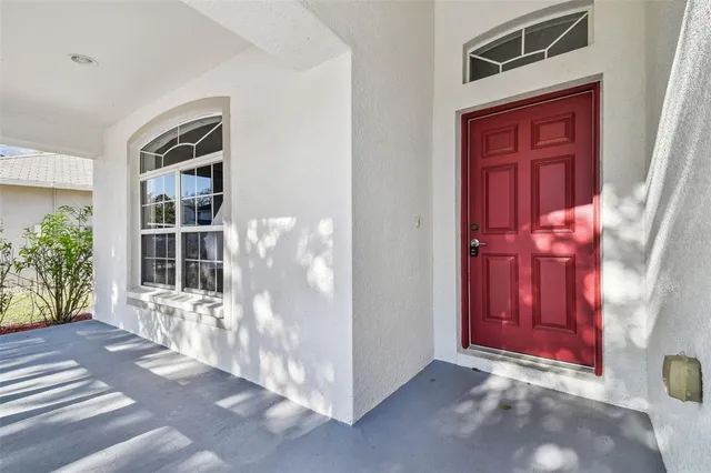 a view of a elevator with a red door and front door