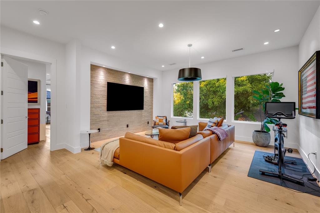 5531 Goodwin Avenue Dallas, TX 75206 - Photo 23 of 39 Living area with light wood-type flooring and recessed lighting