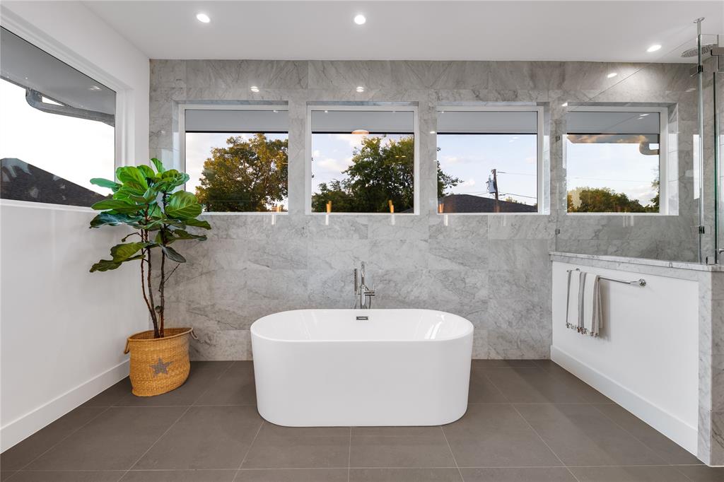 5531 Goodwin Avenue Dallas, TX 75206 - Photo 26 of 39 Full bathroom featuring tile walls, a freestanding bath, a shower stall, recessed lighting, and tile patterned flooring