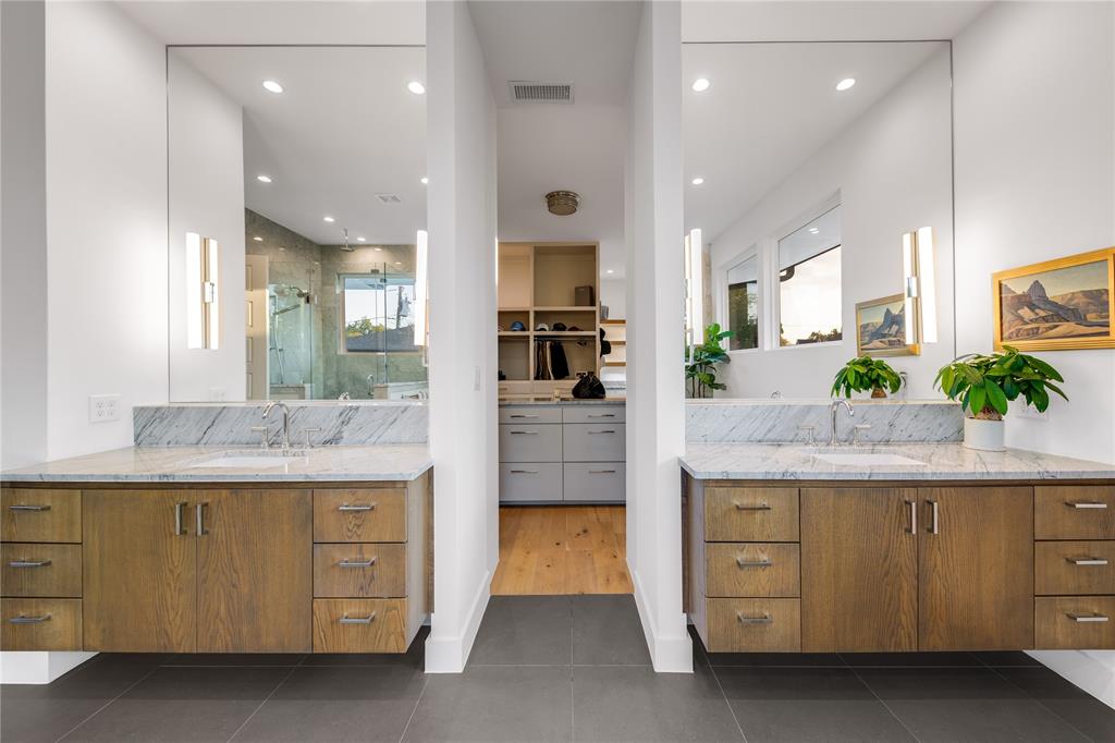 5531 Goodwin Avenue Dallas, TX 75206 - Photo 27 of 39 Full bathroom with two vanities, a stall shower, a spacious closet, recessed lighting, and dark tile patterned floors