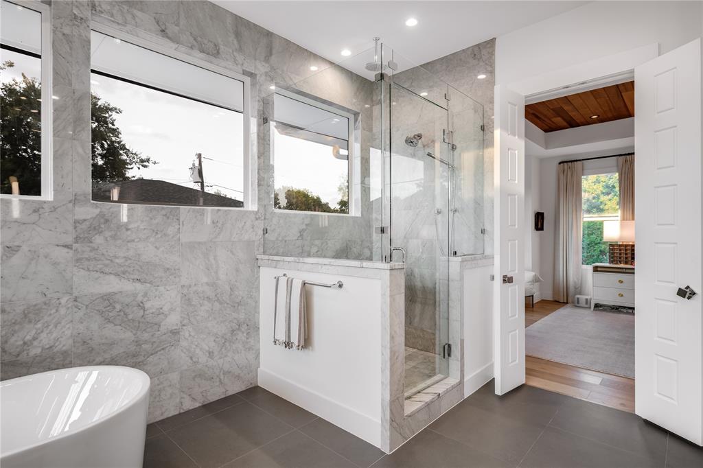 5531 Goodwin Avenue Dallas, TX 75206 - Photo 28 of 39 Full bath featuring a shower stall, a soaking tub, dark tile patterned floors, ensuite bathroom, and recessed lighting