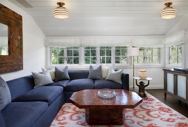 a living room with furniture and a rug