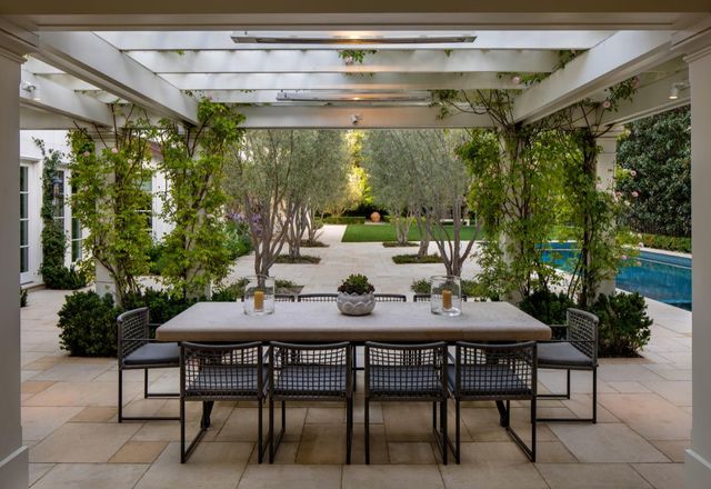a table and chairs in front of a building