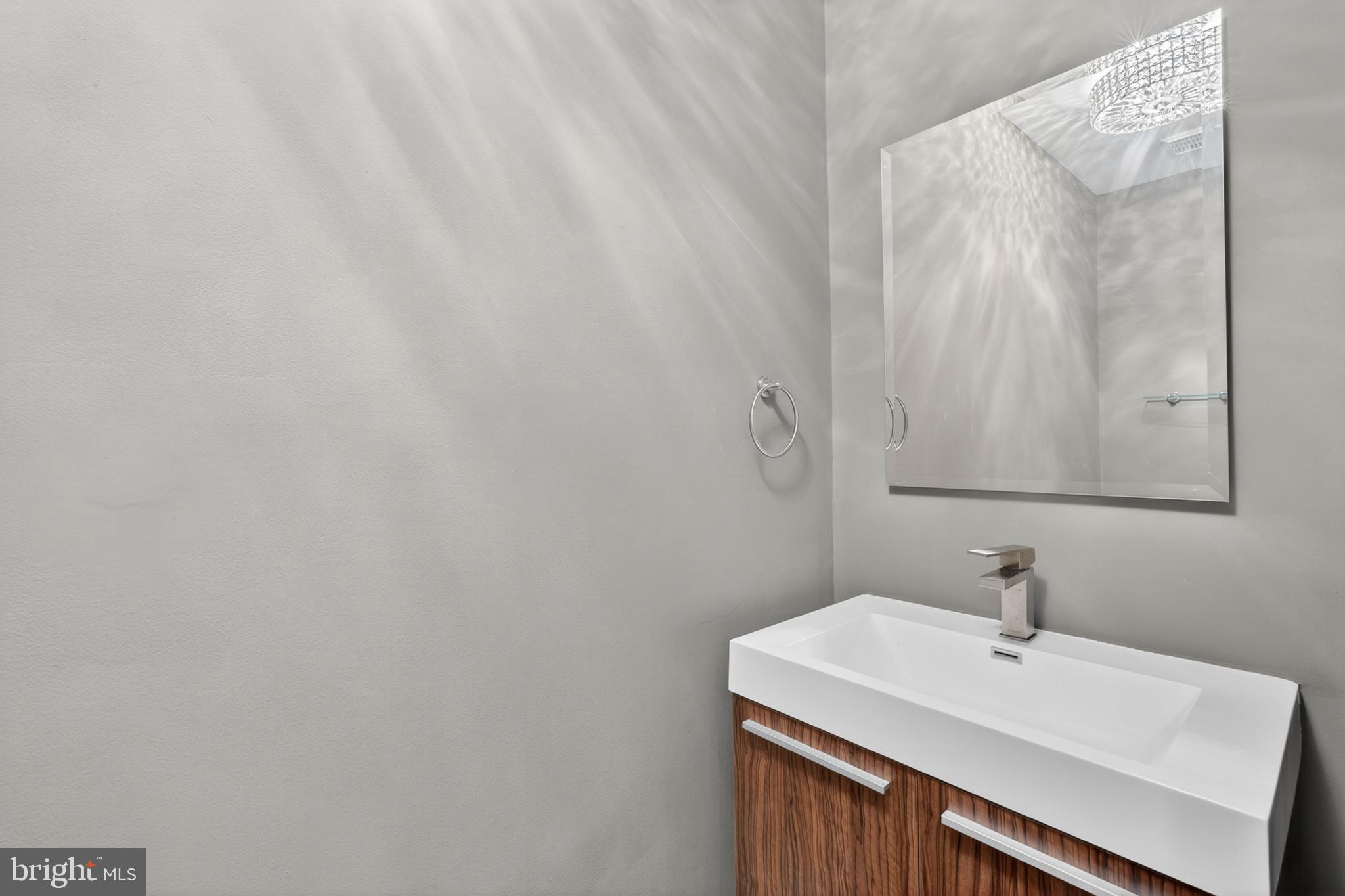 6 Nearfield Road Lutherville-Timonium, MD 21093 - Photo 35 of 71 a bathroom with a sink and a mirror