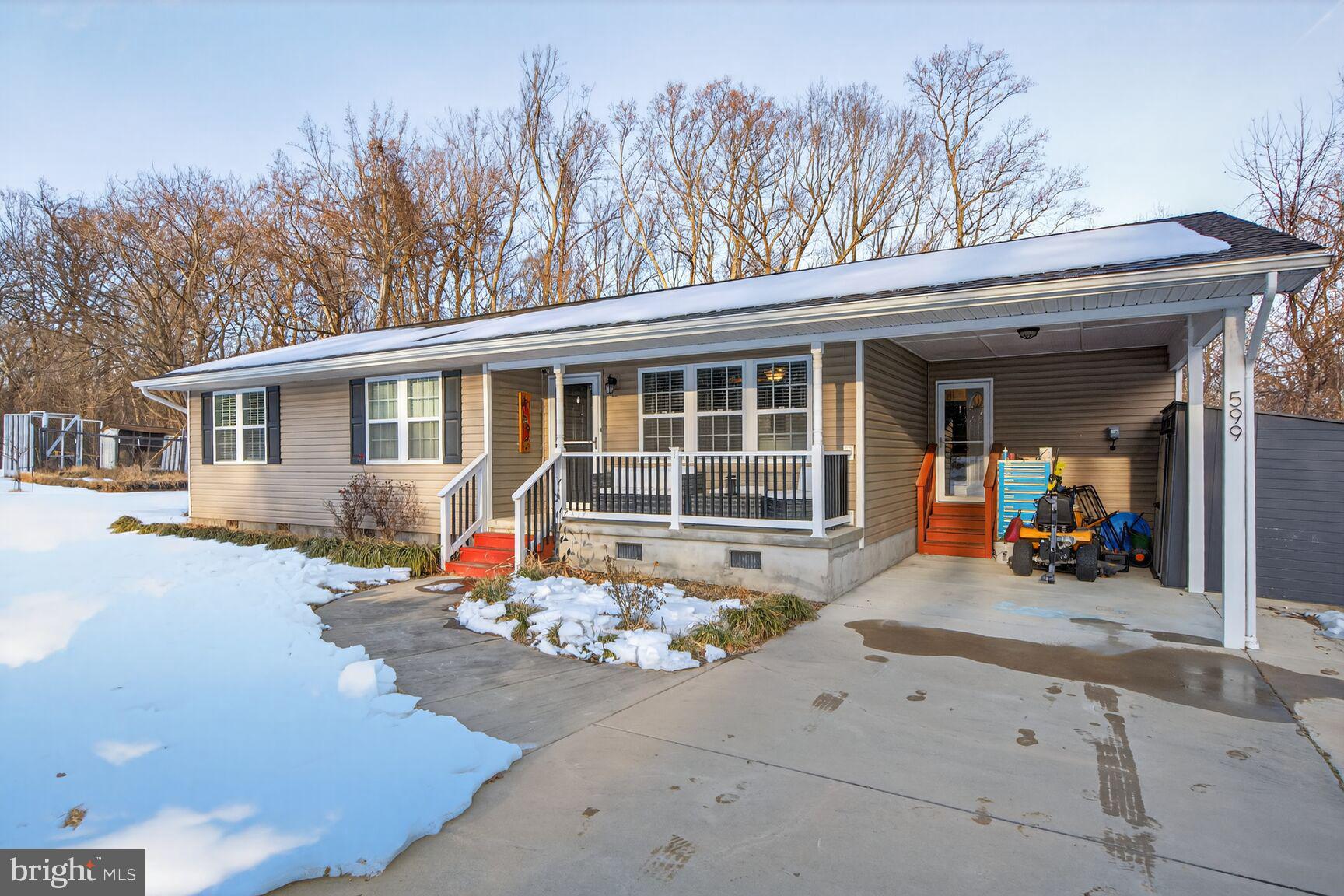 599 Widewater Road Stafford, VA 22554 - Photo 1 of 27 a front view of a house with an outdoor seating
