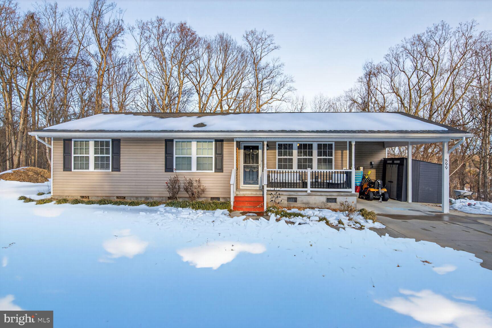 599 Widewater Road Stafford, VA 22554 - Photo 2 of 27 a front view of a house with a sitting space