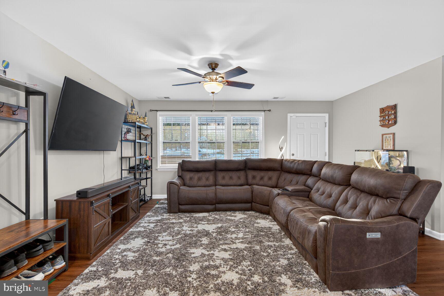 599 Widewater Road Stafford, VA 22554 - Photo 26 of 27 a living room with furniture and a flat screen tv