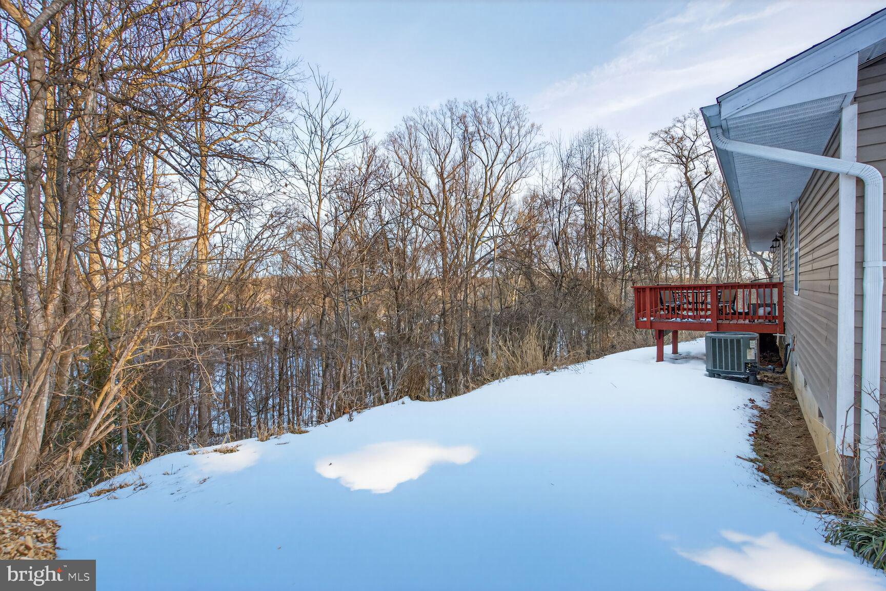 599 Widewater Road Stafford, VA 22554 - Photo 7 of 27 a view of a house with a snow in the yard
