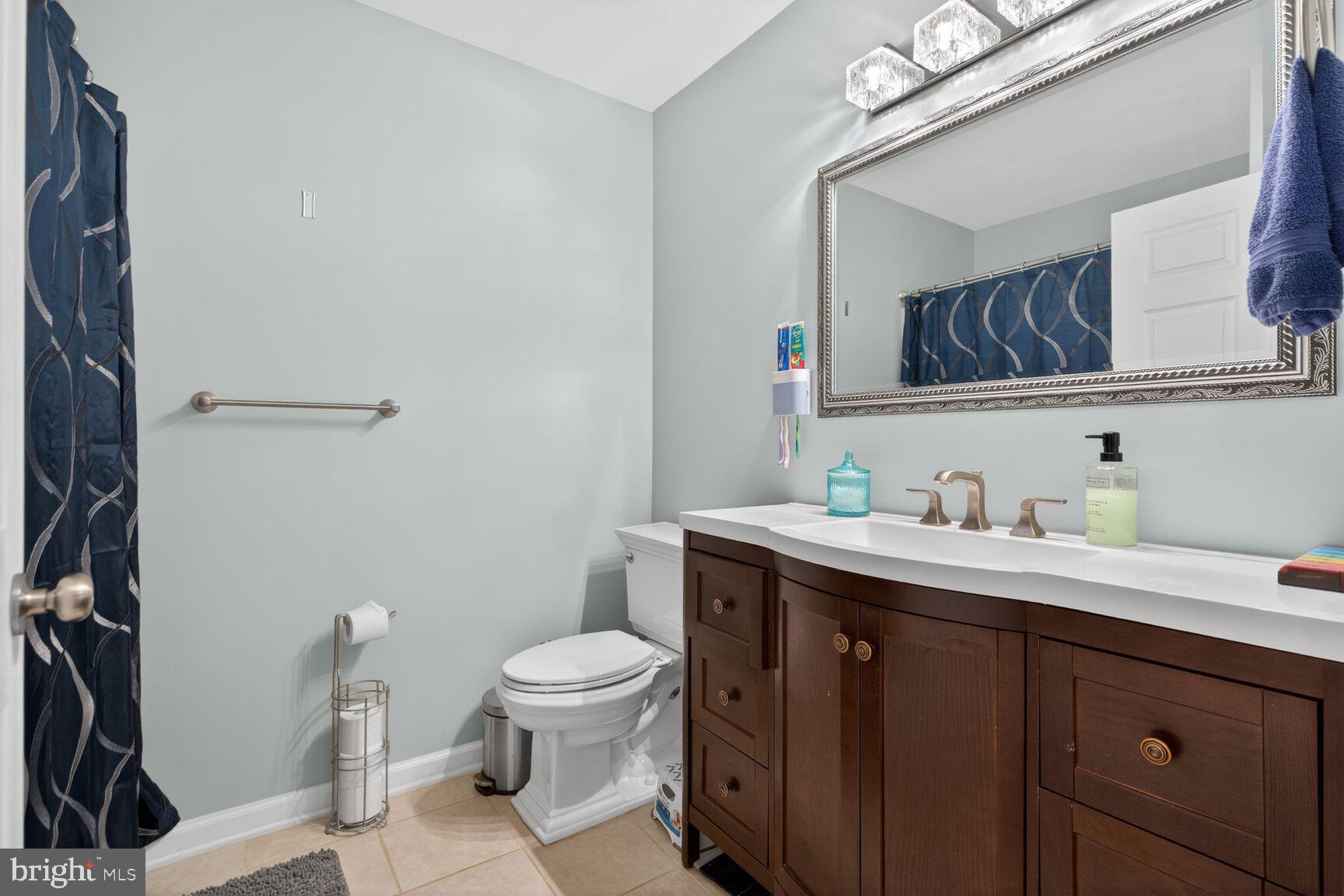 599 Widewater Road Stafford, VA 22554 - Photo 8 of 27 a view of bathroom with a toilet sink and mirror