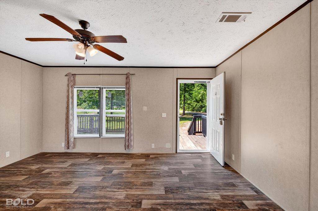 2153 Highway 2 Plain Dealing, LA 71064 - Photo 15 of 39 a view of a livingroom with a ceiling fan and window