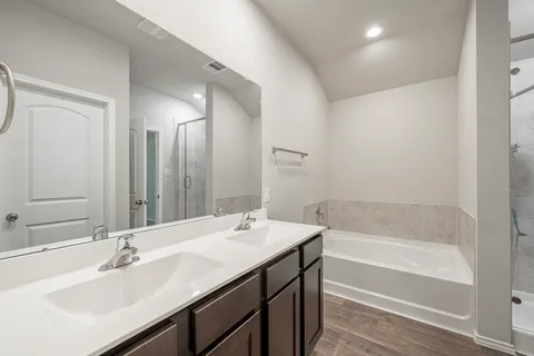a bathroom with a bathtub and a sink
