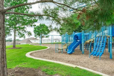 a view of a park with swings