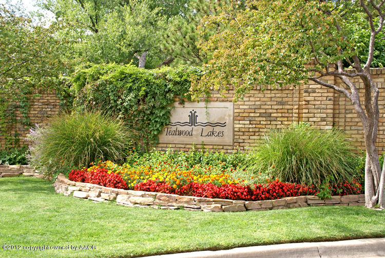 8 Edgewater Drive Amarillo, TX 79106 - Photo 38 of 41 a bunch of flowers in front of a house