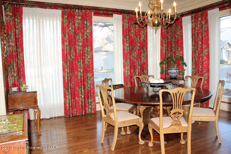 8 Edgewater Drive Amarillo, TX 79106 - Photo 4 of 41 a view of a dining room with furniture and chandelier window