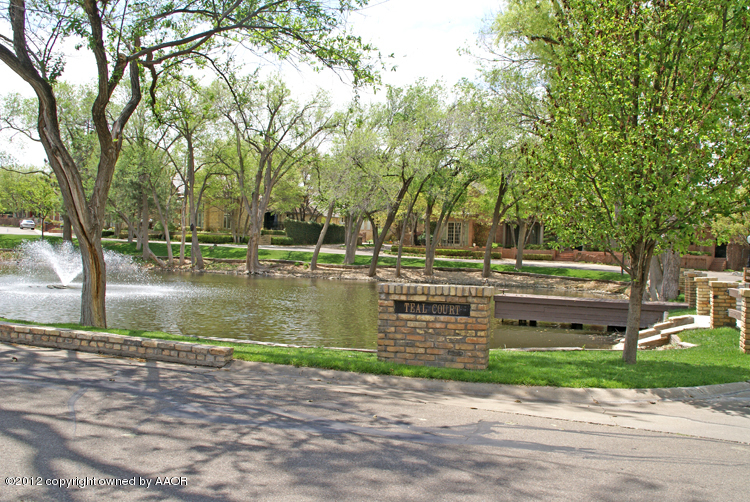 8 Edgewater Drive Amarillo, TX 79106 - Photo 41 of 41 a view of lake with a building in the background