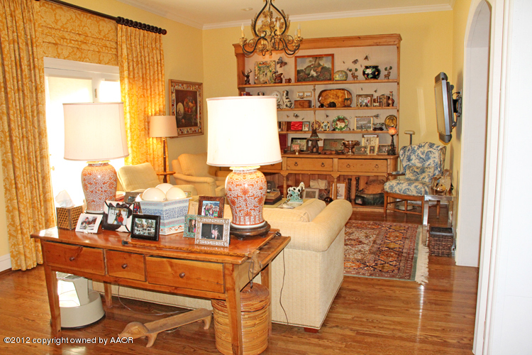8 Edgewater Drive Amarillo, TX 79106 - Photo 6 of 41 a living room with furniture and a chandelier