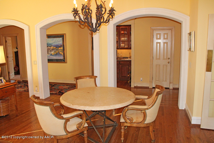 8 Edgewater Drive Amarillo, TX 79106 - Photo 8 of 41 a dining room with furniture and wooden floor