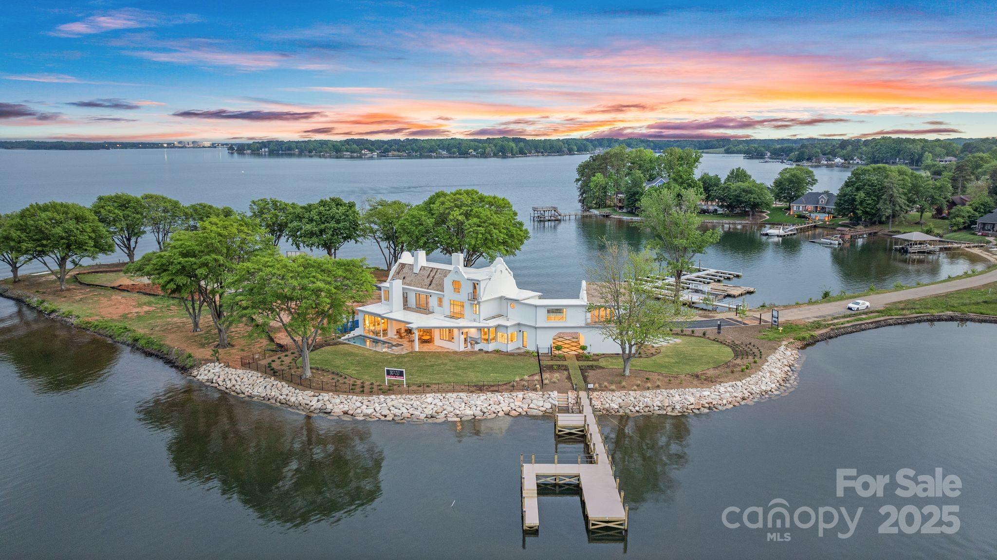 8397 Ranger Island Marina Road Denver, NC 28037 - Photo 19 of 48 a view of a lake with a house in the background