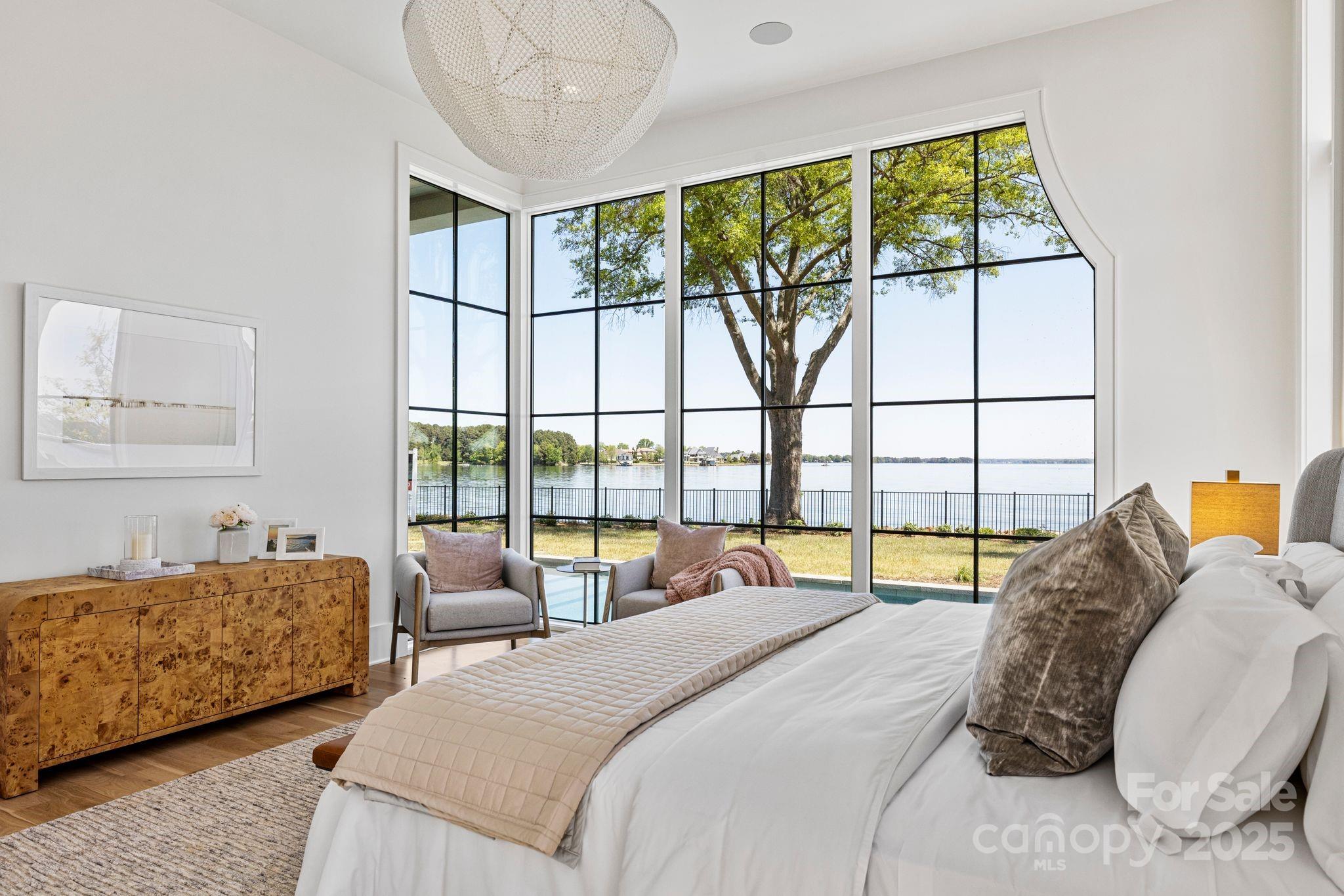 8397 Ranger Island Marina Road Denver, NC 28037 - Photo 23 of 48 a bedroom with a bed and a large window