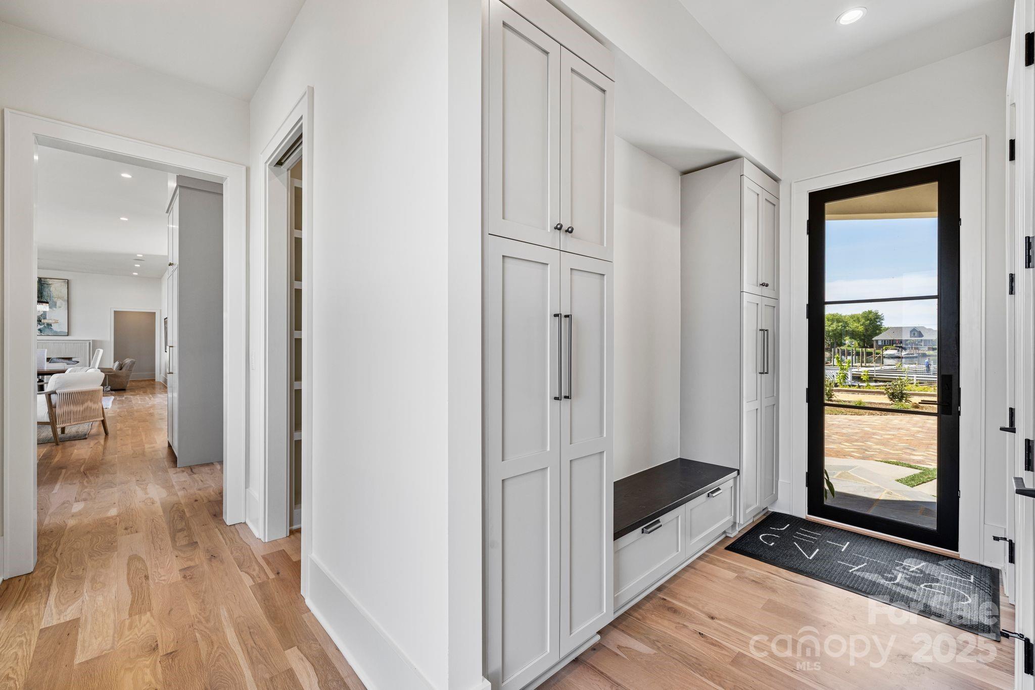 8397 Ranger Island Marina Road Denver, NC 28037 - Photo 29 of 48 a view of a hallway with wooden floor and windows in a room