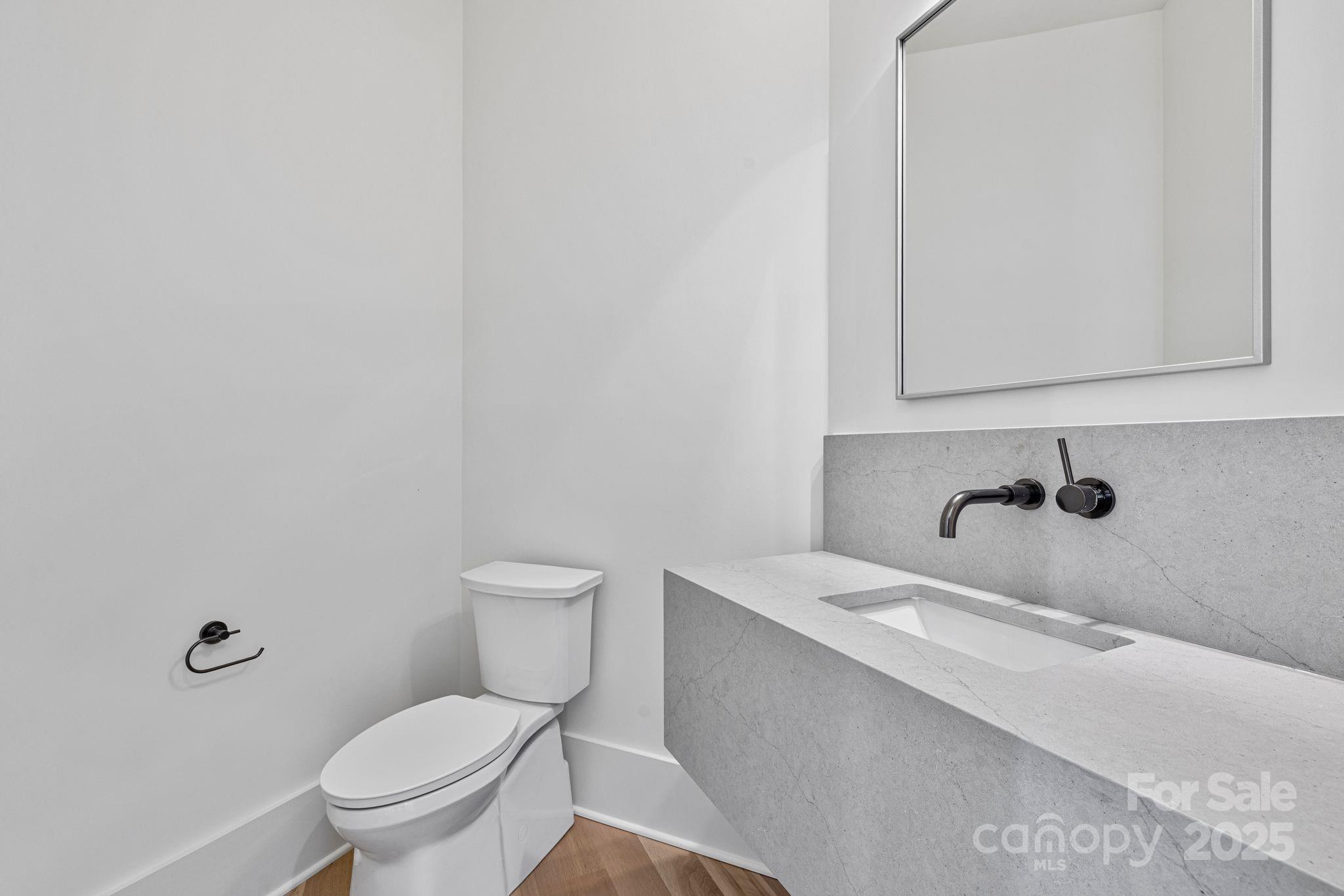 8397 Ranger Island Marina Road Denver, NC 28037 - Photo 30 of 48 a bathroom with a sink and a toilet