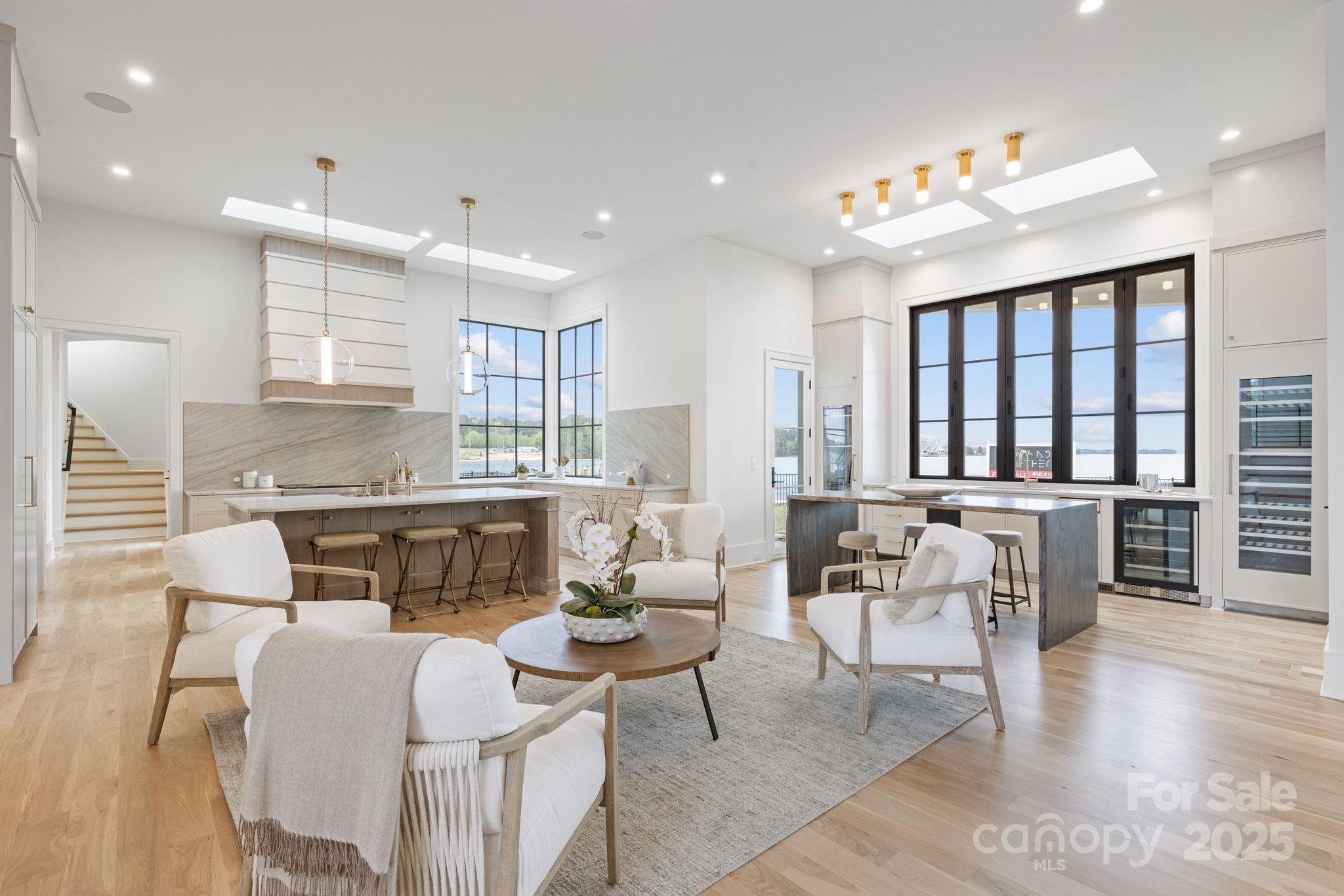 8397 Ranger Island Marina Road Denver, NC 28037 - Photo 3 of 48 a living room with furniture a dining table and a large window