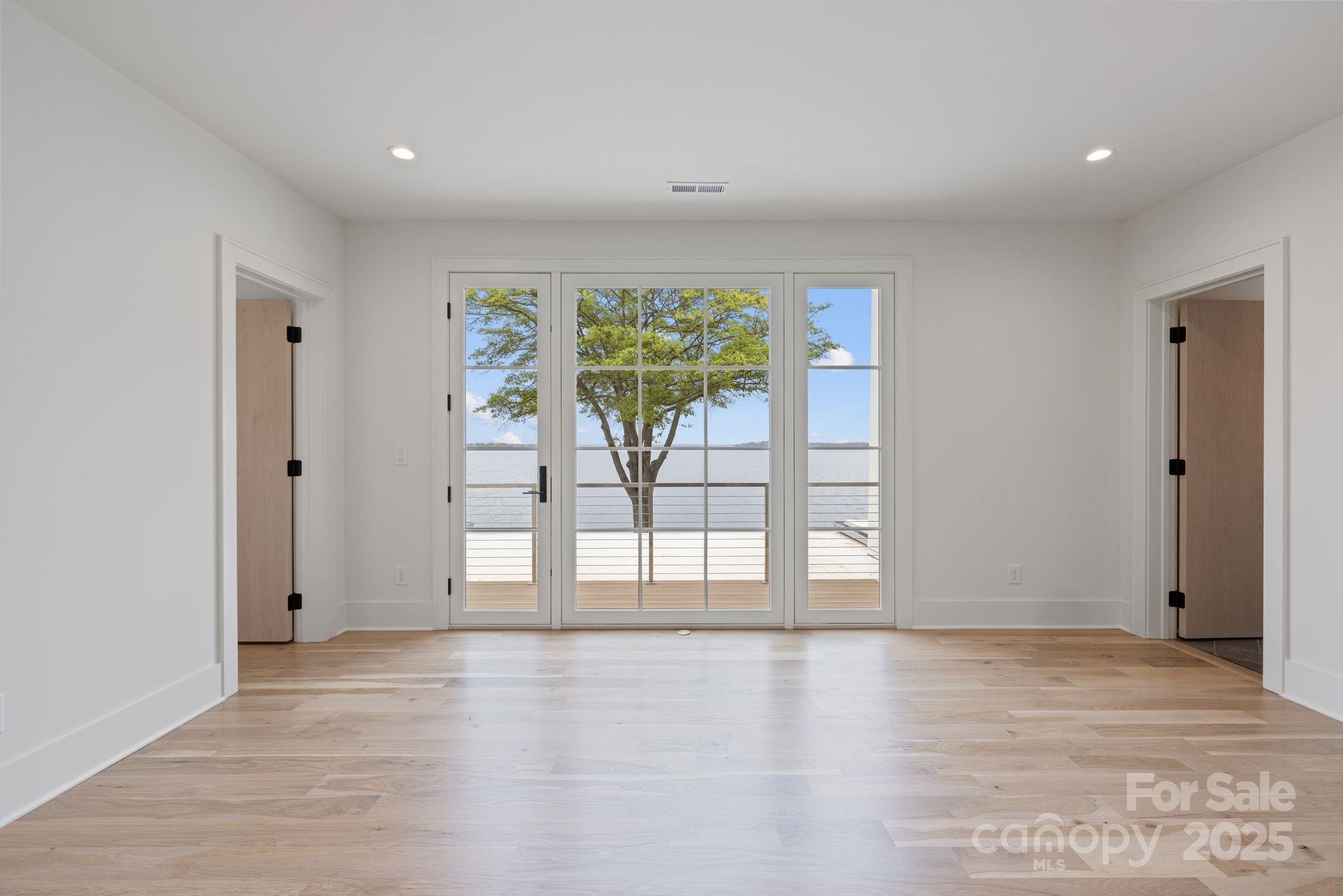 8397 Ranger Island Marina Road Denver, NC 28037 - Photo 32 of 48 a view of an empty room with a window