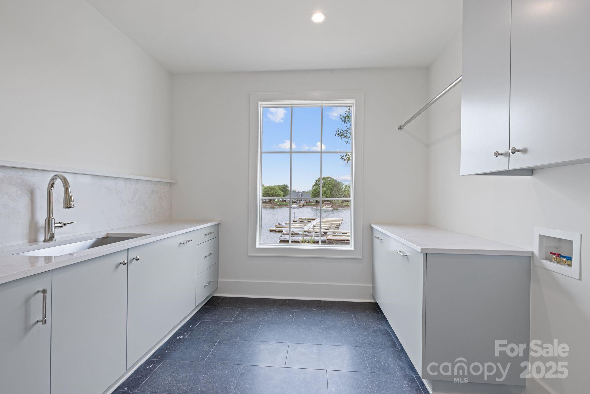 8397 Ranger Island Marina Road Denver, NC 28037 - Photo 39 of 48 a view of cabinets a sink and a window in a room