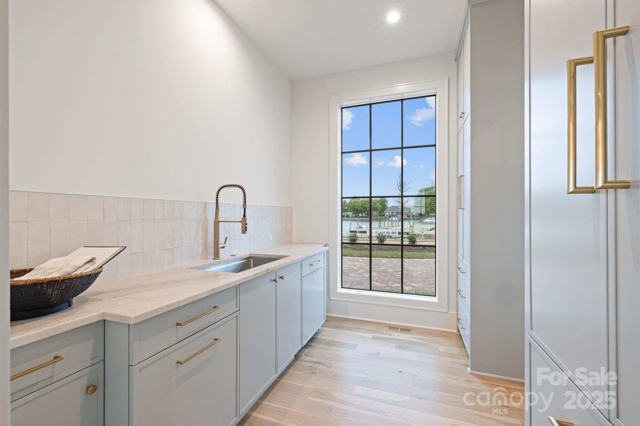 8397 Ranger Island Marina Road Denver, NC 28037 - Photo 42 of 48 a kitchen with a sink and cabinets