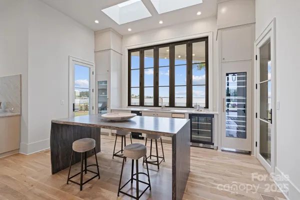 a view of a a dining room with furniture window and wooden floor
