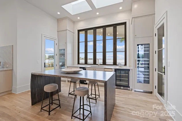 a view of a a dining room with furniture window and wooden floor