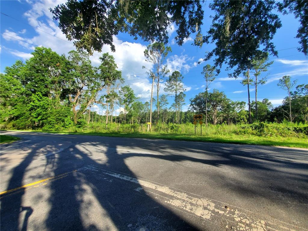 0 Northwest 115th Avenue Reddick, FL 32686 - Photo 7 of 10 a view of a swimming pool with an outdoor space and seating area
