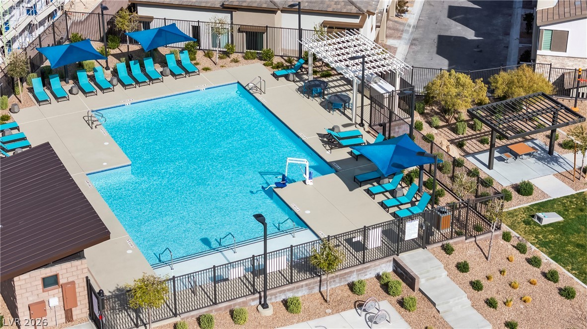 633 Infinity Rdg Street Las Vegas, NV 89138 - Photo 25 of 30 Community pool with a patio area