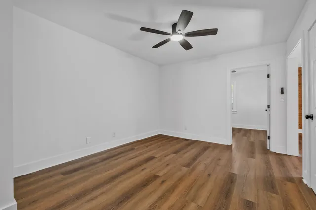 a kitchen with white cabinets stainless steel appliances and sink