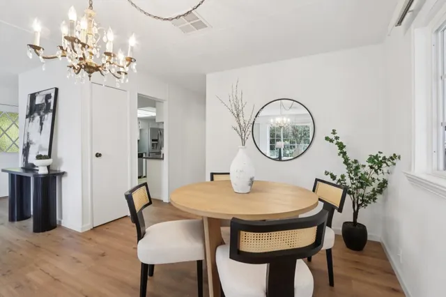 a kitchen with kitchen island a sink appliances and cabinets