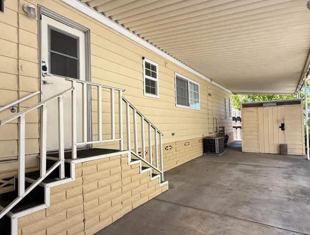 a picture of a bathroom with a white wall and a picture